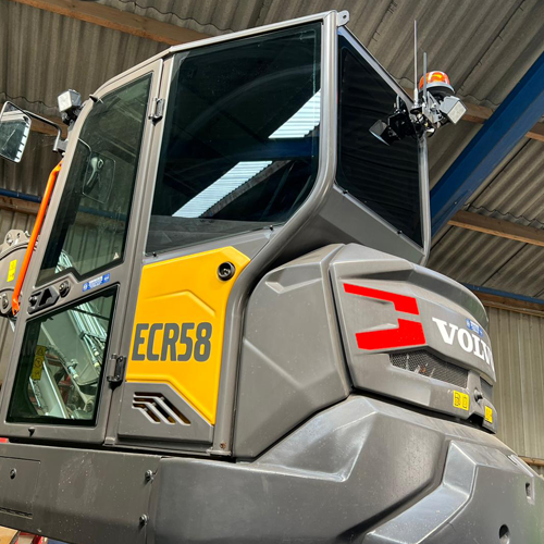 Zonwerende folie op graafmachine